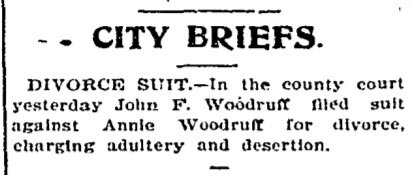 Newspaper clipping headlined Divorce Suit, reporting that John T. Woodruff has filed suit for divorce against his wife, Annie, on grounds of adultery and desertion.